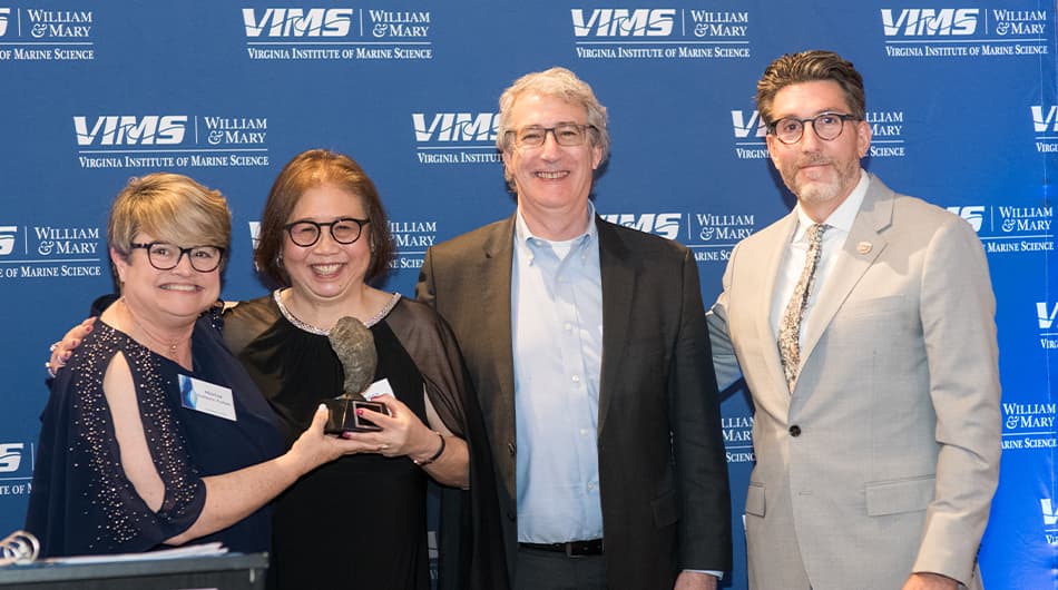 Rick and Susan Hill (center) receive the prestigious Pathfinder Award from VIMS Executive Director of Advancement Marise Robbins-Forbes (left) and VIMS Dean & Director Derek Aday (right).