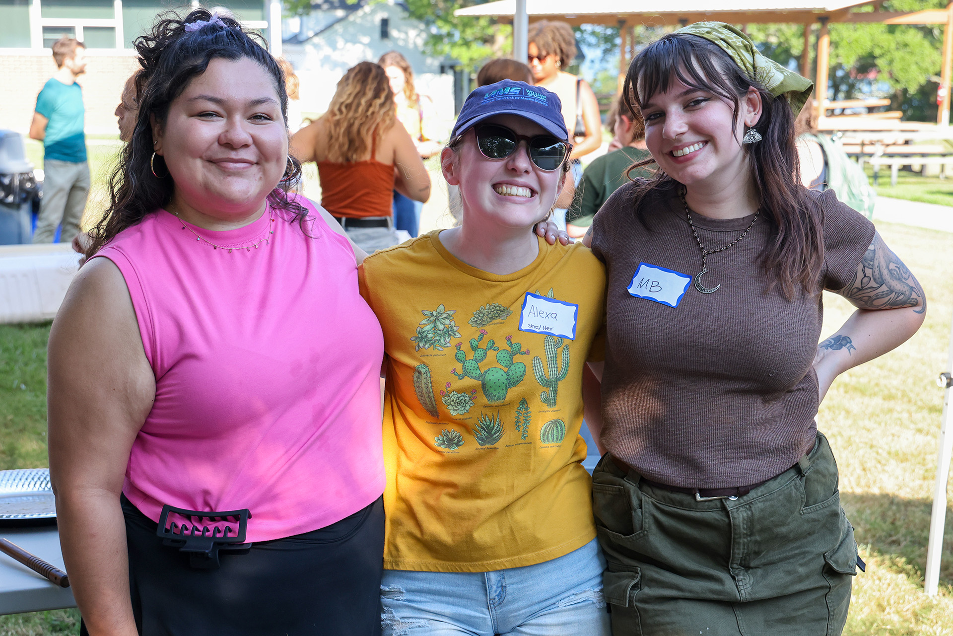 Andie Munoz (left), co-president of the Graduate Student Association, joined by fellow student volunteer Alexa Labossiere and 2024 M.A. graduate and current research technician Mary Beth Armstrong. (Photo by John Wallace)