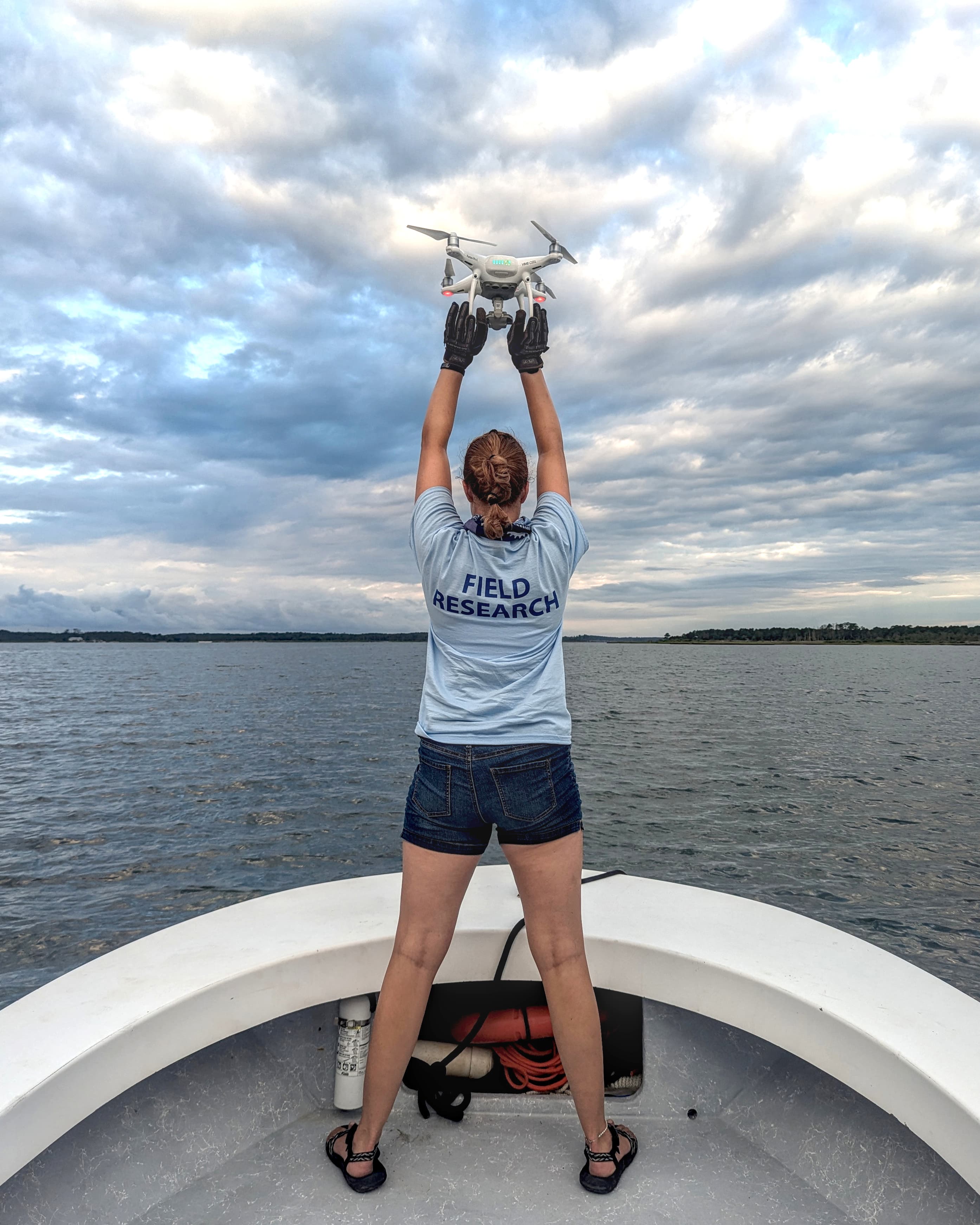 Ph.D. student Alyson Hall's category-winning photo captured a fellow graduate student launching a research drone.