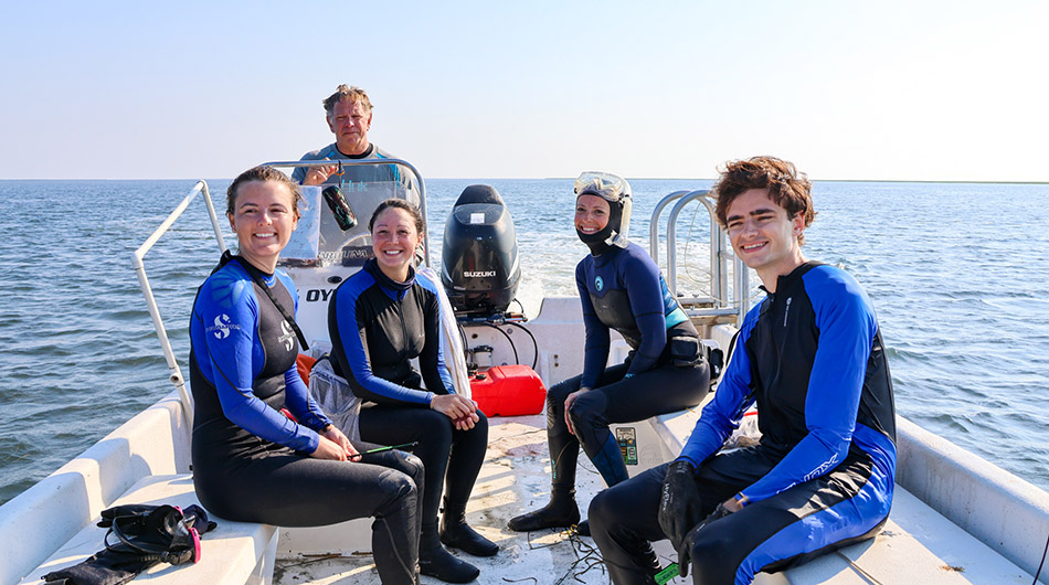 One of the VIMS survey teams. Each boat is manned by a minimum of five surveyors who are assigned to numerous survey stations. (Photo by John Wallace)